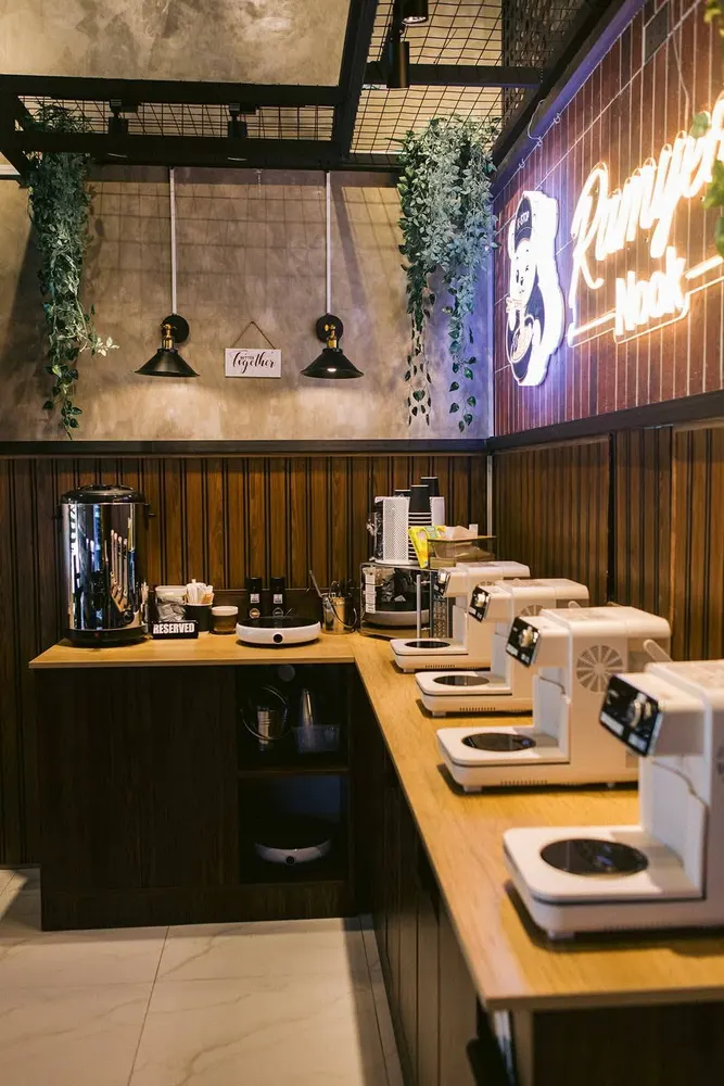DIY cooking counter at K-Stop with induction plates, hot water urn and cups